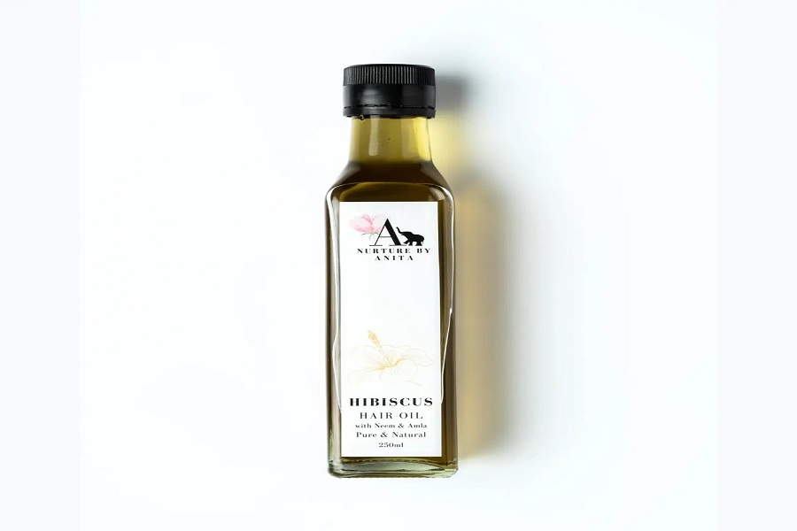 Nurture By Anita Hair Fall Control Oil bottle for reducing hair fall and strengthening hair naturally